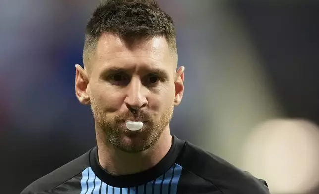 Argentina's Lionel Messi blows a bubble ahead of a Copa America Group A soccer match against Canada in Atlanta, Thursday, June 20, 2024. (AP Photo/Mike Stewart)