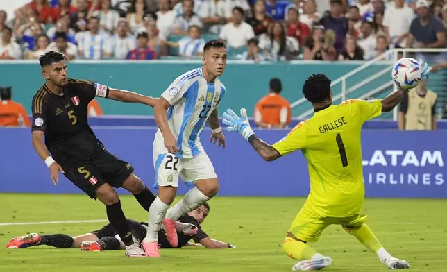 Argentina's Lautaro Martínez (22) scores his side's second goal against Peru during a Copa America Group A soccer match in Miami Gardens, Fla., Saturday, June 29, 2024. (AP Photo/Lynne Sladky)
