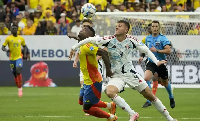 Colombia's Jhon Cordoba, left, and Costa Rica's Juan Pablo Vargas battle for the ball during a Copa America Group D soccer match in Glendale, Ariz., Friday, June 28, 2024. (AP Photo/Rick Scuteri)
