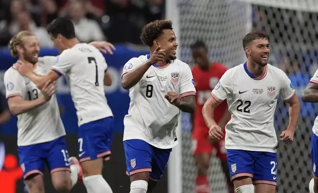 Weston McKennie of the United States (8), and teammates celebrate a goal that was later disallowed by a VAR decision during a Copa America Group C soccer match against Panama in Atlanta, Thursday, June 27, 2024. (AP Photo/Mike Stewart)