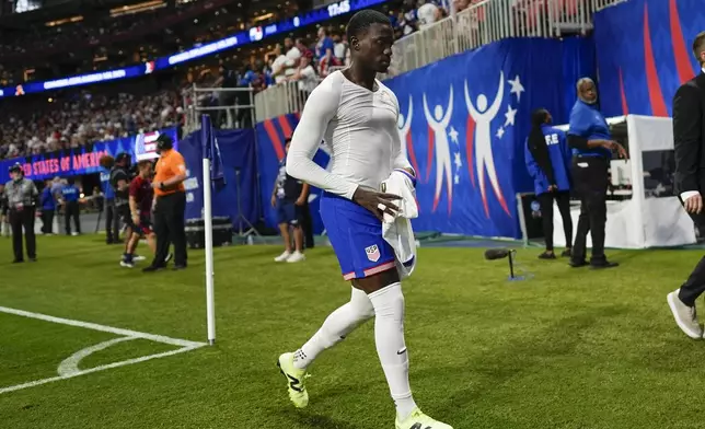 Tim Weah of the United States leaves the field after receiving a red card during a Copa America Group C soccer match against Panama in Atlanta, Thursday, June 27, 2024. (AP Photo/Mike Stewart)