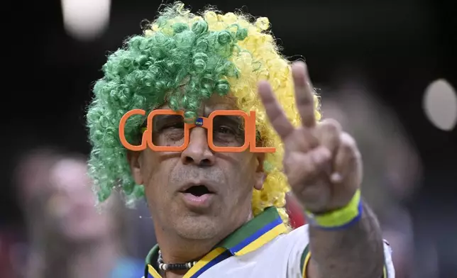 A fan supporting Brazil waits for the start of a Copa America Group D soccer match against Paraguay in Las Vegas, Friday, June 28, 2024. (AP Photo/David Becker)