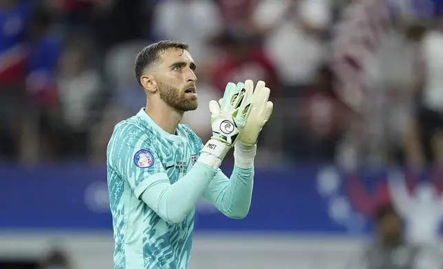 Goalkeeper Matt Turner of the United States celebrates his team's 2-0 victory over Bolivia at the end of a Copa America Group C soccer match in Arlington, Texas, Sunday, June 23, 2024. (AP Photo/Tony Gutierrez)