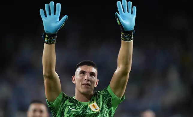 Uruguay's goalkeeper Sergio Rochet celebrates his team's 5-0 victory over Bolivia at the end of a Copa America Group C soccer match in East Rutherford, N.J., Thursday, June 27, 2024. (AP Photo/Julia Nikhinson)