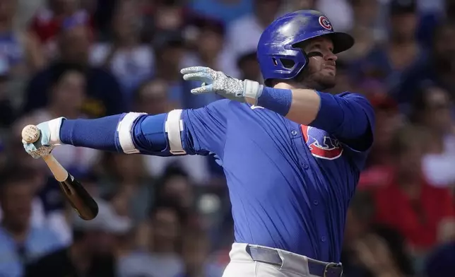 Chicago Cubs' Ian Happ hits a two-run home run during the eighth inning of a baseball game against the Milwaukee Brewers, Saturday, June 29, 2024, in Milwaukee. (AP Photo/Aaron Gash)