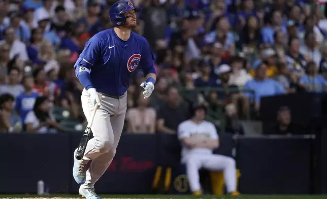Chicago Cubs' Ian Happ watches his two-run home run during the eighth inning of a baseball game against the Milwaukee Brewers, Saturday, June 29, 2024, in Milwaukee. (AP Photo/Aaron Gash)
