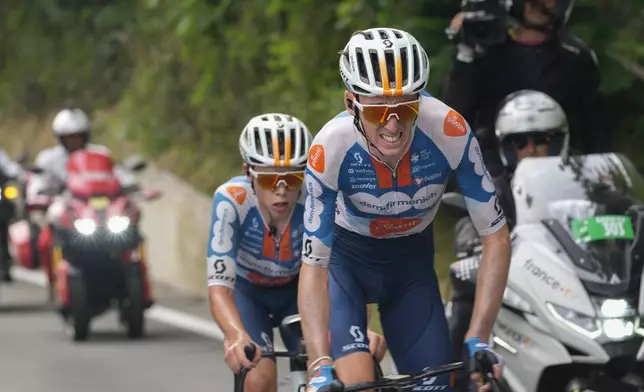 France's Romain Bardet, front, and teammate Netherlands' Frank van den Broek ride breakaway during the first stage of the Tour de France cycling race over 206 kilometers (128 miles) with start in Florence and finish in Rimini, Italy, Saturday, June 29, 2024. (AP Photo/Jerome Delay)