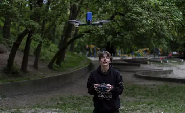 Misha Soboliev, 17, tests a drone that he built in school, in Kyiv, Ukraine, on May 3, 2024. built a drone to send to his father's army unit. (AP Photo/Alex Babenko)