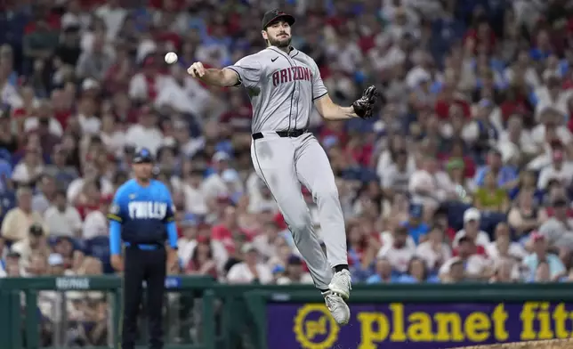 Arizona Diamondbacks pitcher Ryan Thompson throws to first after fielding a ground out by Philadelphia Phillies' Alec Bohm during the eighth inning of a baseball game, Friday, June 21, 2024, in Philadelphia. (AP Photo/Matt Slocum)