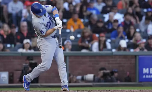 Los Angeles Dodgers' Will Smith hits a two-run double against the San Francisco Giants during the 11th inning of a baseball game Saturday, June 29, 2024, in San Francisco. (AP Photo/Godofredo A. Vásquez)