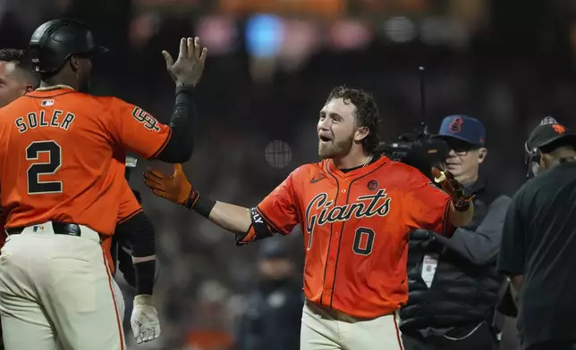 San Francisco Giants' Brett Wisely (0) celebrates with Jorge Soler after hitting a game-wining, two-run home run against the Los Angeles Dodgers during the ninth inning of a baseball game Friday, June 28, 2024, in San Francisco. (AP Photo/Godofredo A. Vásquez)