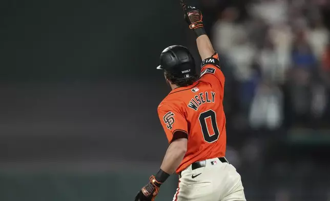 San Francisco Giants' Brett Wisely celebrates after hitting a game-winning, two-run home run against the Los Angeles Dodgers during the ninth inning of a baseball game Friday, June 28, 2024, in San Francisco. (AP Photo/Godofredo A. Vásquez)