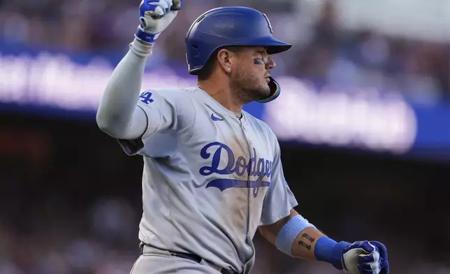 Los Angeles Dodgers' Miguel Rojas gestures after hitting an RBI single against the San Francisco Giants during the 10th inning of a baseball game Saturday, June 29, 2024, in San Francisco. (AP Photo/Godofredo A. Vásquez)