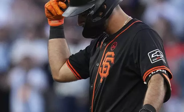 San Francisco Giants' David Villar reacts after hitting an RBI double against the Los Angeles Dodgers during the 10th inning of a baseball game Saturday, June 29, 2024, in San Francisco. (AP Photo/Godofredo A. Vásquez)