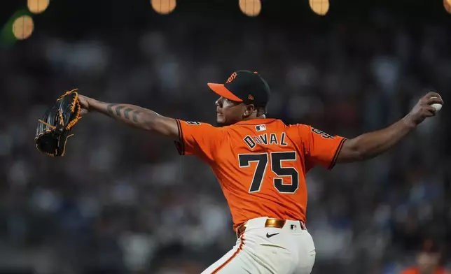 San Francisco Giants pitcher Camilo Doval throws to a Los Angeles Dodgers batter during the ninth inning of a baseball game Friday, June 28, 2024, in San Francisco. (AP Photo/Godofredo A. Vásquez)
