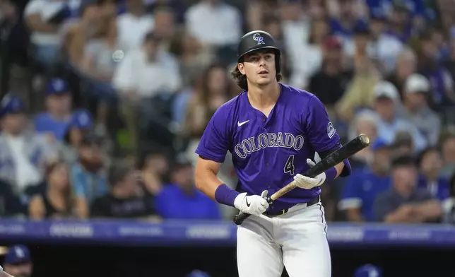 Colorado Rockies' Michael Toglia reacts after striking out against Los Angeles Dodgers starting pitcher James Paxton in the seventh inning of a baseball game Monday, June 17, 2024, in Denver. (AP Photo/David Zalubowski)