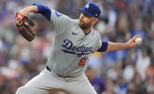 Los Angeles Dodgers starting pitcher James Paxton works against the Colorado Rockies in the fifth inning of a baseball game Monday, June 17, 2024, in Denver. (AP Photo/David Zalubowski)