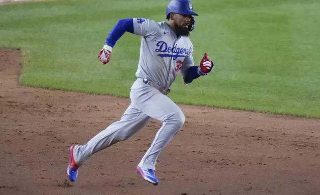 Los Angeles Dodgers' Teoscar Hernández runs to second on a two-run double against the New York Yankees during the 11th inning of a baseball game Friday, June 7, 2024, in New York. The Dodgers won 2-1. (AP Photo/Frank Franklin II)