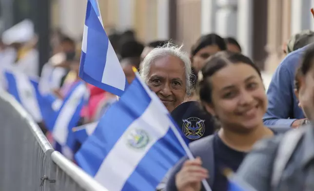 Supporters of El Salvador's President Nayib Bukele line up outside of the National Palace prior to his inauguration for a second term in San Salvador, El Salvador. Saturday, June 1, 2024. (AP Photo/Salvador Melendez)