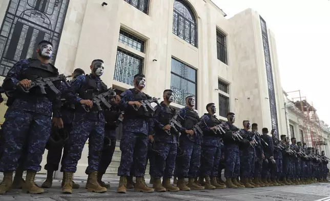 Military forces stand outside of the National Palace prior to El Salvador's President Nayib Bukele's inauguration for a second term in San Salvador, El Salvador, Saturday, June 1, 2024. (AP Photo/Salvador Melendez)
