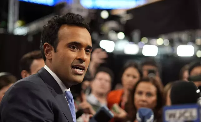 Vivek Ramaswamy speaks to reporters in the spin room before a presidential debate between President Joe Biden and Republican presidential candidate former President Donald Trump in Atlanta, Thursday, June 27, 2024. (AP Photo/Pablo Martinez Monsivais)