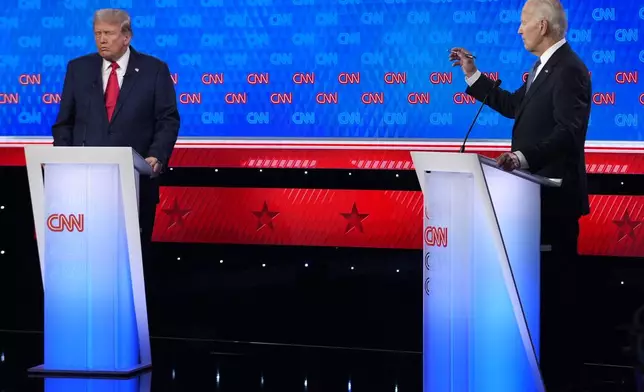 President Joe Biden, right, and Republican presidential candidate former President Donald Trump, left, participate in a presidential debate hosted by CNN, Thursday, June 27, 2024, in Atlanta. (AP Photo/Gerald Herbert)