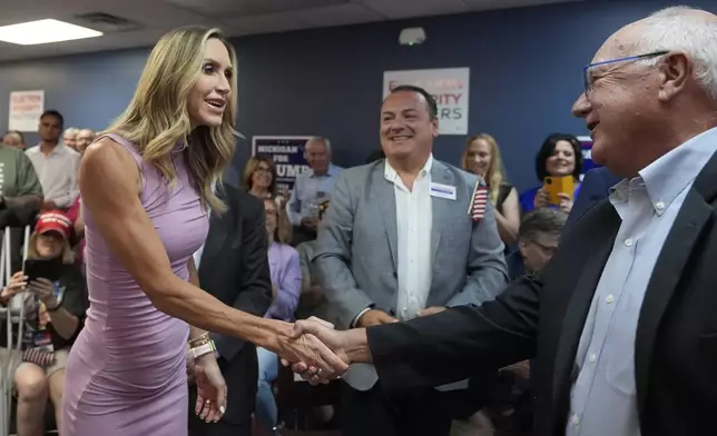 Republican National Committee co-chair Lara Trump arrives and greets Michigan Republican Party Chairman Pete Hoekstra to kickoff an election integrity volunteer training at the Oakland County GOP Headquarters, Friday, June 14, 2024 in Bloomfield Hills, Mich. (AP Photo/Carlos Osorio)