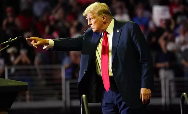 Republican presidential candidate former President Donald Trump gestures to the crowd at a campaign rally, Saturday, June 22, 2024, at Temple University in Philadelphia. (AP Photo/Chris Szagola)