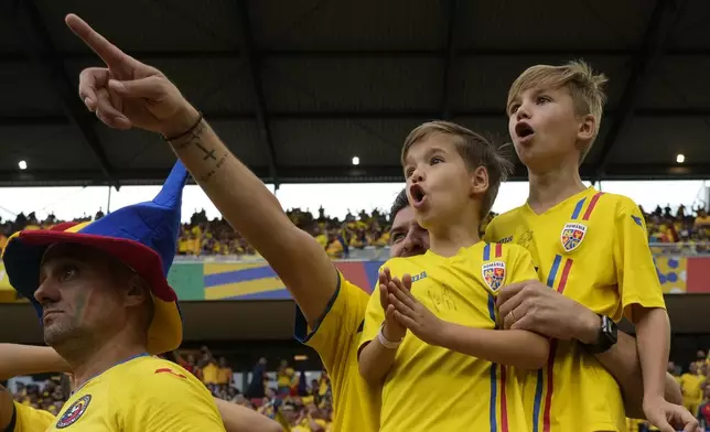 Romania's supporters cheer prior to the start of a Group E match between Belgium and Romania at the Euro 2024 soccer tournament in Cologne, Germany, Saturday, June 22, 2024. (AP Photo/Alessandra Tarantino)