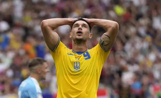 Ukraine's Roman Yaremchuk reacts after a missed scoring opportunity during a Group E match between Ukraine and Belgium at the Euro 2024 soccer tournament in Stuttgart, Germany, Wednesday, June 26, 2024. (AP Photo/Matthias Schrader)