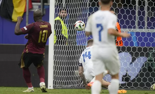 Belgium's Romelu Lukaku, right, scores a second goal which was disallowed shortly after as handball during a Group E match between Belgium and Slovakia at the Euro 2024 soccer tournament in Frankfurt, Germany, Monday, June 17, 2024. (AP Photo/Michael Probst)