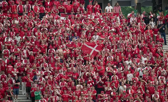 Denmark fans watch a Group C match between Denmark and England at the Euro 2024 soccer tournament in Frankfurt, Germany, Thursday, June 20, 2024. (AP Photo/Thanassis Stavrakis)