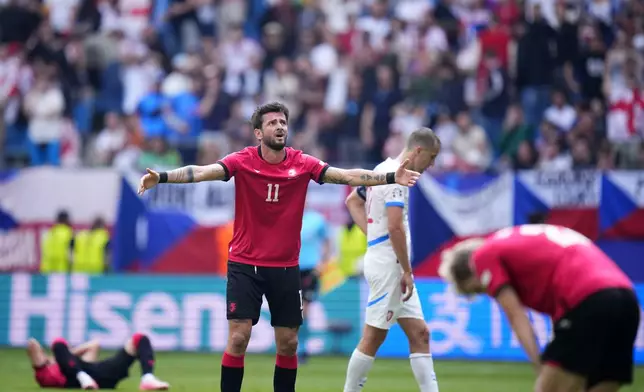 Georgia's Giorgi Kvilitaia reacts after a missed chance to score during a Group F match between Georgia and the Czech Republic at the Euro 2024 soccer tournament in Hamburg, Germany, Saturday, June 22, 2024. (AP Photo/Petr David Josek)