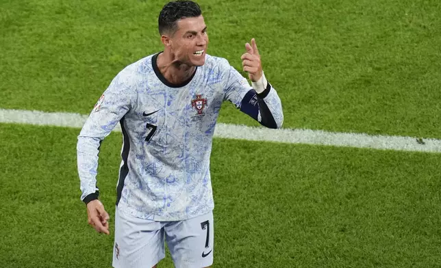 Portugal's Cristiano Ronaldo gestures as he leaves the pitch at half time during a Group F match between Georgia and Portugal at the Euro 2024 soccer tournament in Gelsenkirchen, Germany, Wednesday, June 26, 2024. (AP Photo/Andreea Alexandru)
