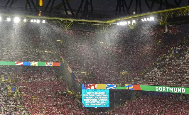 Due to heavy rain during the a round of sixteen match between Germany and Denmark at the Euro 2024 soccer tournament is suspend in Dortmund, Germany, Saturday, June 29, 2024. (Marcus Brandt/dpa via AP)