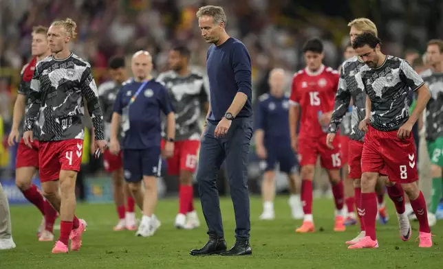 Denmark's head coach Kasper Hjulmand leaves the pitch after a round of sixteen match between Germany and Denmark at the Euro 2024 soccer tournament in Dortmund, Germany, Saturday, June 29, 2024. (AP Photo/Andreea Alexandru)