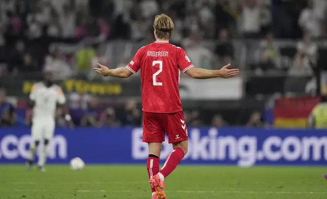 Denmark's Joachim Andersen reacts to a VAR decision that disallowed the goal he scored during a round of sixteen match between Germany and Denmark at the Euro 2024 soccer tournament in Dortmund, Germany, Saturday, June 29, 2024. (AP Photo/Andreea Alexandru)