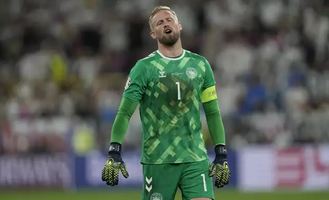 Denmark's goalkeeper Kasper Schmeichel gestures during a round of sixteen match at the Euro 2024 soccer tournament against Germany in Dortmund, Germany, Saturday, June 29, 2024. (AP Photo/Darko Vojinovic)