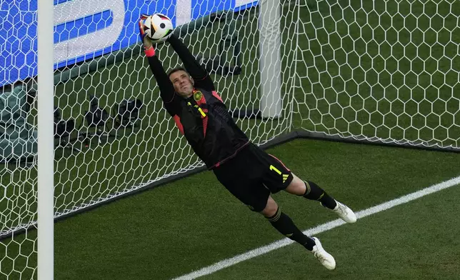 Germany's goalkeeper Manuel Neuer stops a shot during a Group A match between Germany and Hungary at the Euro 2024 soccer tournament in Stuttgart, Germany, Wednesday, June 19, 2024. (AP Photo/Themba Hadebe)