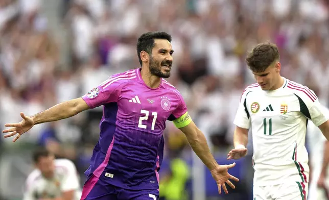 Germany's Ilkay Gundogan, left, celebrates after scoring his side's second goal during a Group A match between Germany and Hungary at the Euro 2024 soccer tournament in Stuttgart, Germany, Wednesday, June 19, 2024. (Spada/LaPresse via AP)