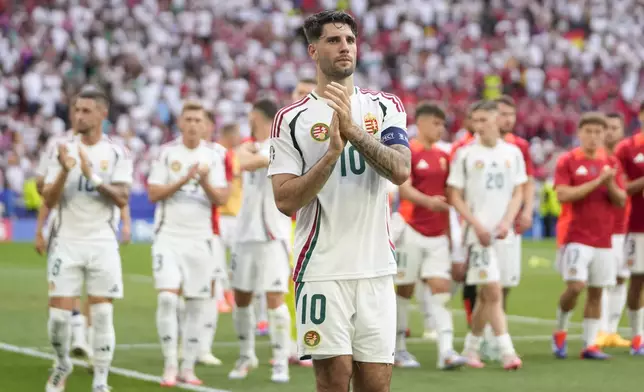 Hungary's Dominik Szoboszlai (10) applauds on the pitch after a Group A match between Germany and Hungary at the Euro 2024 soccer tournament in Stuttgart, Germany, Wednesday, June 19, 2024. (AP Photo/Darko Vojinovic)