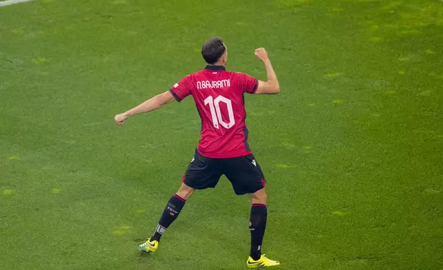 Albania's Nedim Bajrami celebrates after scoring his side's opening goal during a Group B match between Italy and Albania at the Euro 2024 soccer tournament in Dortmund, Germany, Saturday, June 15, 2024. (AP Photo/Andreea Alexandru)