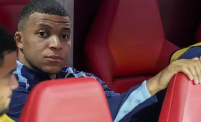 Kylian Mbappe of France looks out from the bench before a Group D match between the Netherlands and France at the Euro 2024 soccer tournament in Leipzig, Germany, Friday, June 21, 2024. (AP Photo/Ariel Schalit)