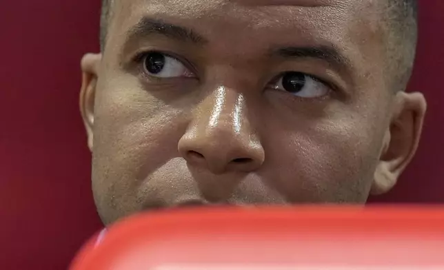 Kylian Mbappe of France looks out from the bench before a Group D match between the Netherlands and France at the Euro 2024 soccer tournament in Leipzig, Germany, Friday, June 21, 2024. (AP Photo/Ariel Schalit)