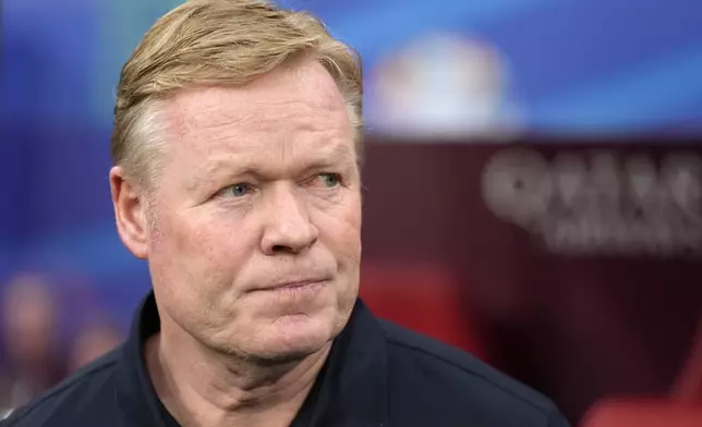 Netherlands' head coach Ronald Koeman stands on the side line at the beginning of a Group D match between the Netherlands and France at the Euro 2024 soccer tournament in Leipzig, Germany, Friday, June 21, 2024. (AP Photo/Mathias Schrader)