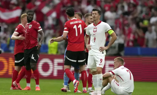 Poland's Robert Lewandowski (9) reacts after during a Group D match between Poland and Austria at the Euro 2024 soccer tournament in Berlin, Germany, Friday, June 21, 2024. (AP Photo/Sunday Alamba)