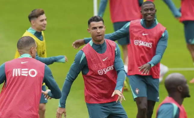 Portugal's Cristiano Ronaldo trains with his teammates during a training session in Gutersloh, Germany, Friday, June 14, 2024. Portugal will play against Czech Republic during their Group F soccer match at the Euro 2024 soccer tournament on June 18. (AP Photo/Hassan Ammar)