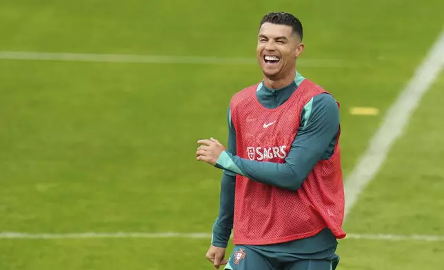 Portugal's Cristiano Ronaldo gestures during a training session in Gutersloh, Germany, Friday, June 14, 2024. Portugal will play against Czech Republic during their Group F soccer match at the Euro 2024 soccer tournament on June 18. (AP Photo/Hassan Ammar)