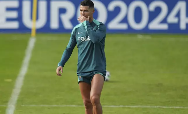 Portugal's Cristiano Ronaldo gestures during a training session in Gutersloh, Germany, Friday, June 14, 2024. Portugal will play against Czech Republic during their Group F soccer match at the Euro 2024 soccer tournament on June 18. (AP Photo/Hassan Ammar)