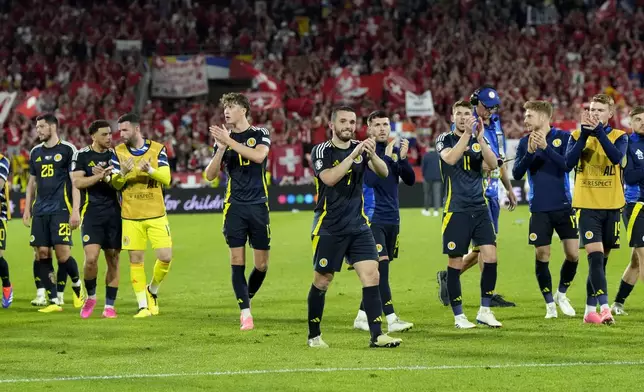 Scotland players react after a Group A match between Scotland and Switzerland at the Euro 2024 soccer tournament in Cologne, Germany, Wednesday, June 19, 2024. (AP Photo/Martin Meissner)